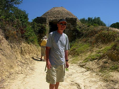 person in front of Tholos IV